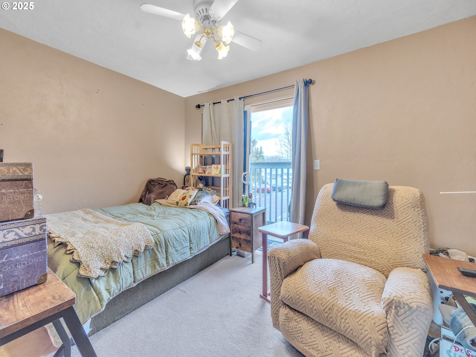 2551 Southwest Pickford Street, Unit D Corvallis, OR 97333 - Photo 20 of 25 a bedroom with a bed and wooden floor