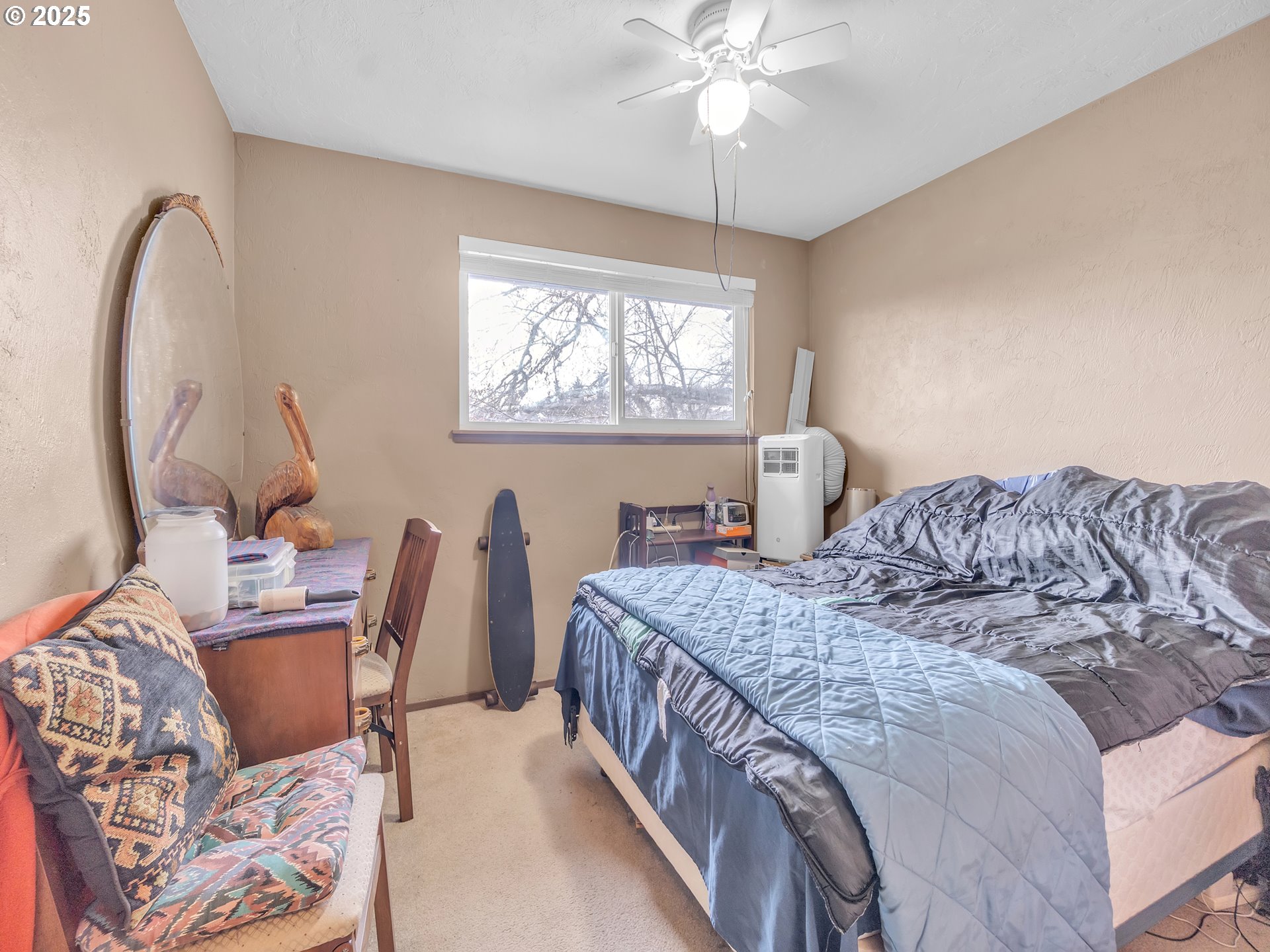 2551 Southwest Pickford Street, Unit D Corvallis, OR 97333 - Photo 21 of 25 a bedroom with double bed and a window