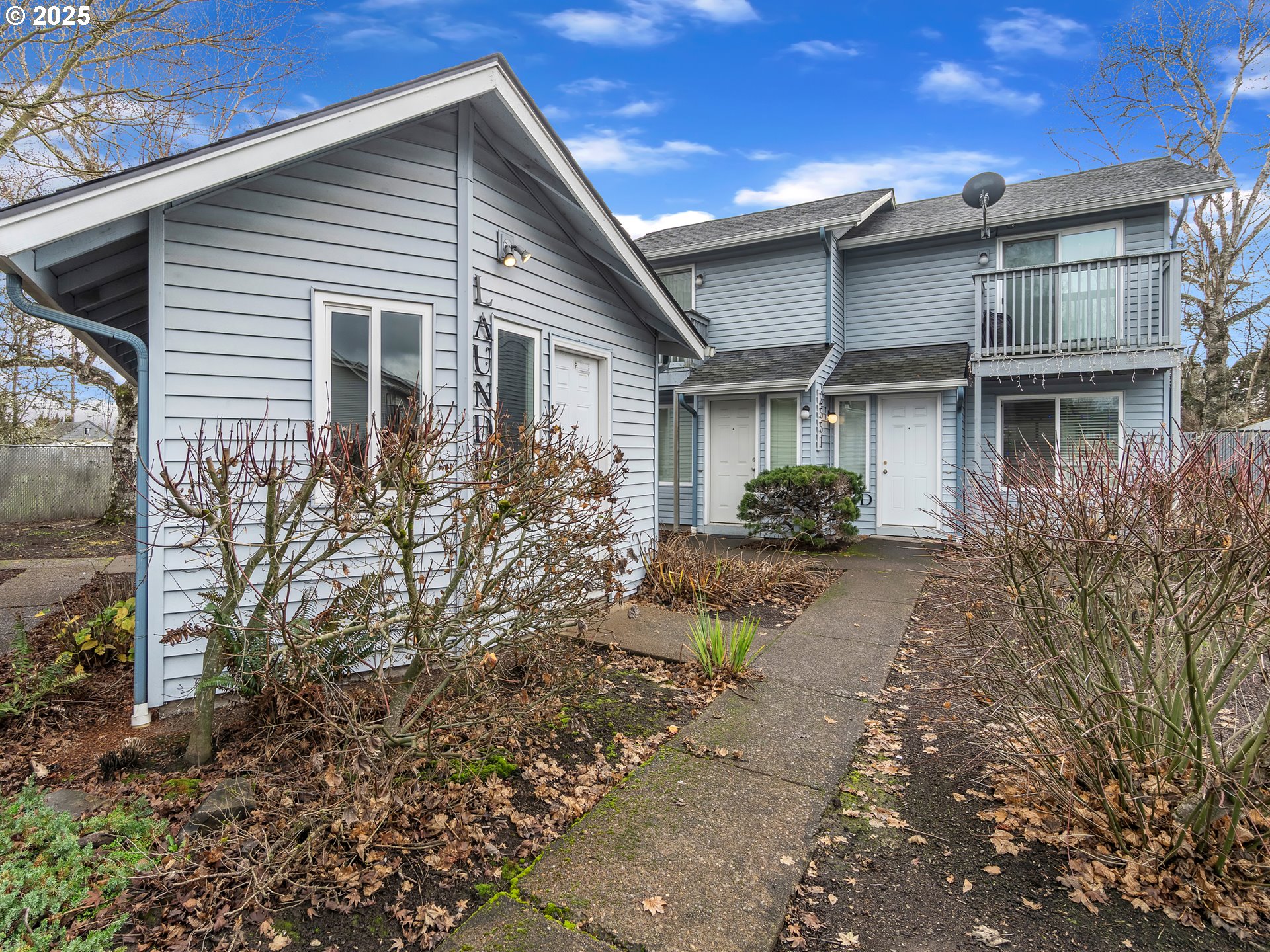 2551 Southwest Pickford Street, Unit D Corvallis, OR 97333 - Photo 3 of 25 a front view of a house with garden