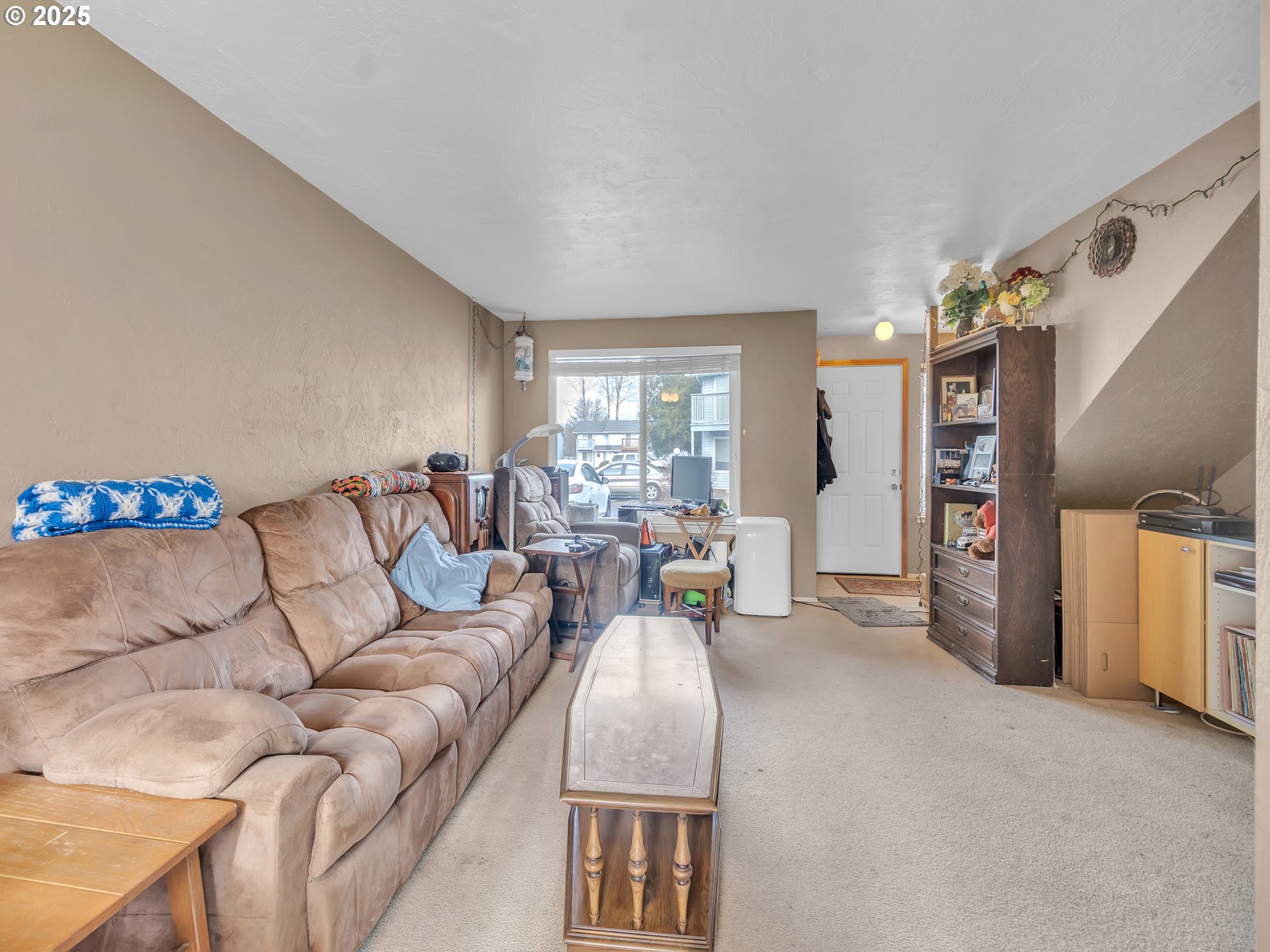 2551 Southwest Pickford Street, Unit D Corvallis, OR 97333 - Photo 5 of 25 a living room with furniture and a flat screen tv