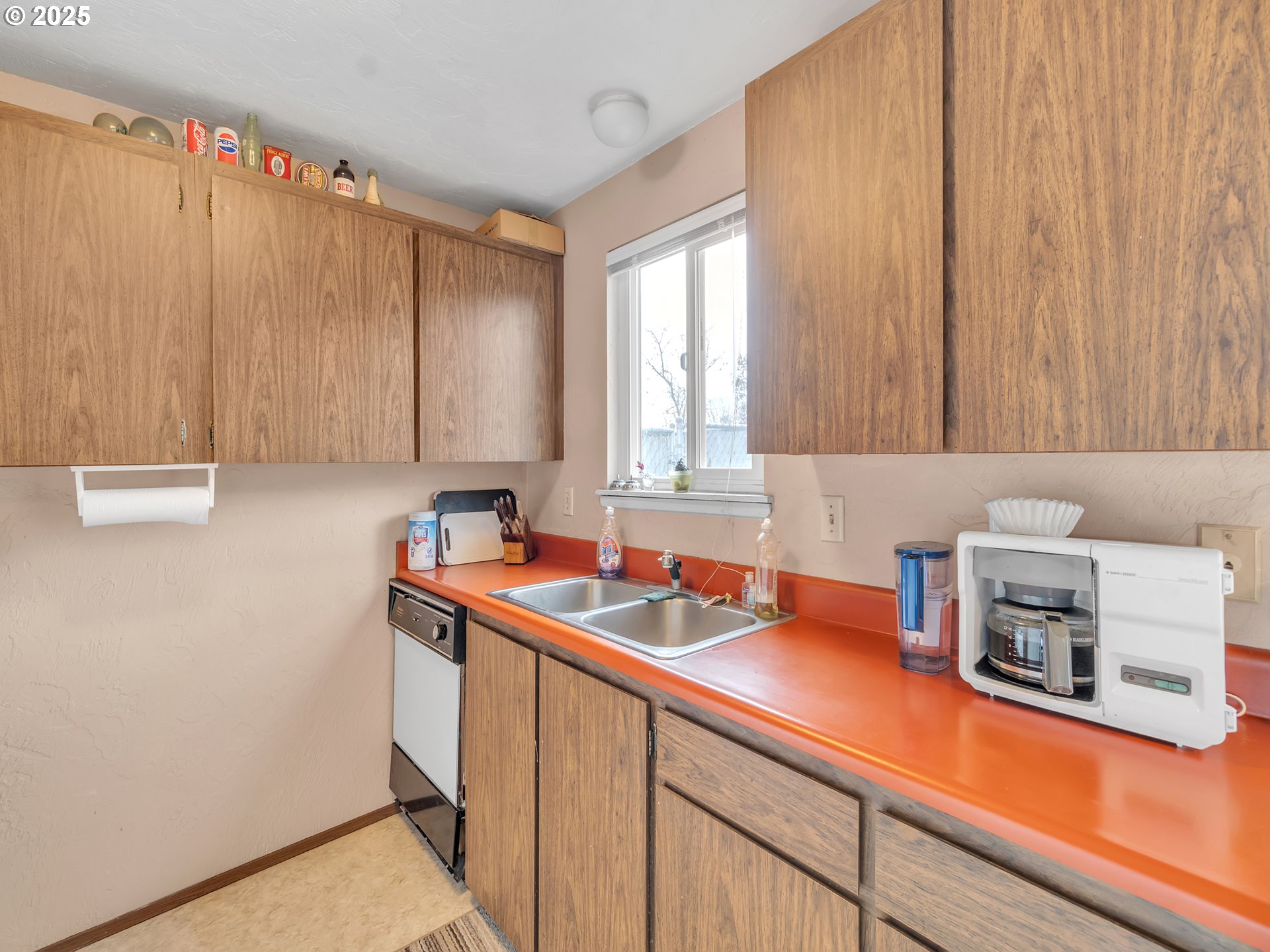 2551 Southwest Pickford Street, Unit D Corvallis, OR 97333 - Photo 10 of 25 a kitchen with stainless steel appliances a sink dishwasher window and cabinets