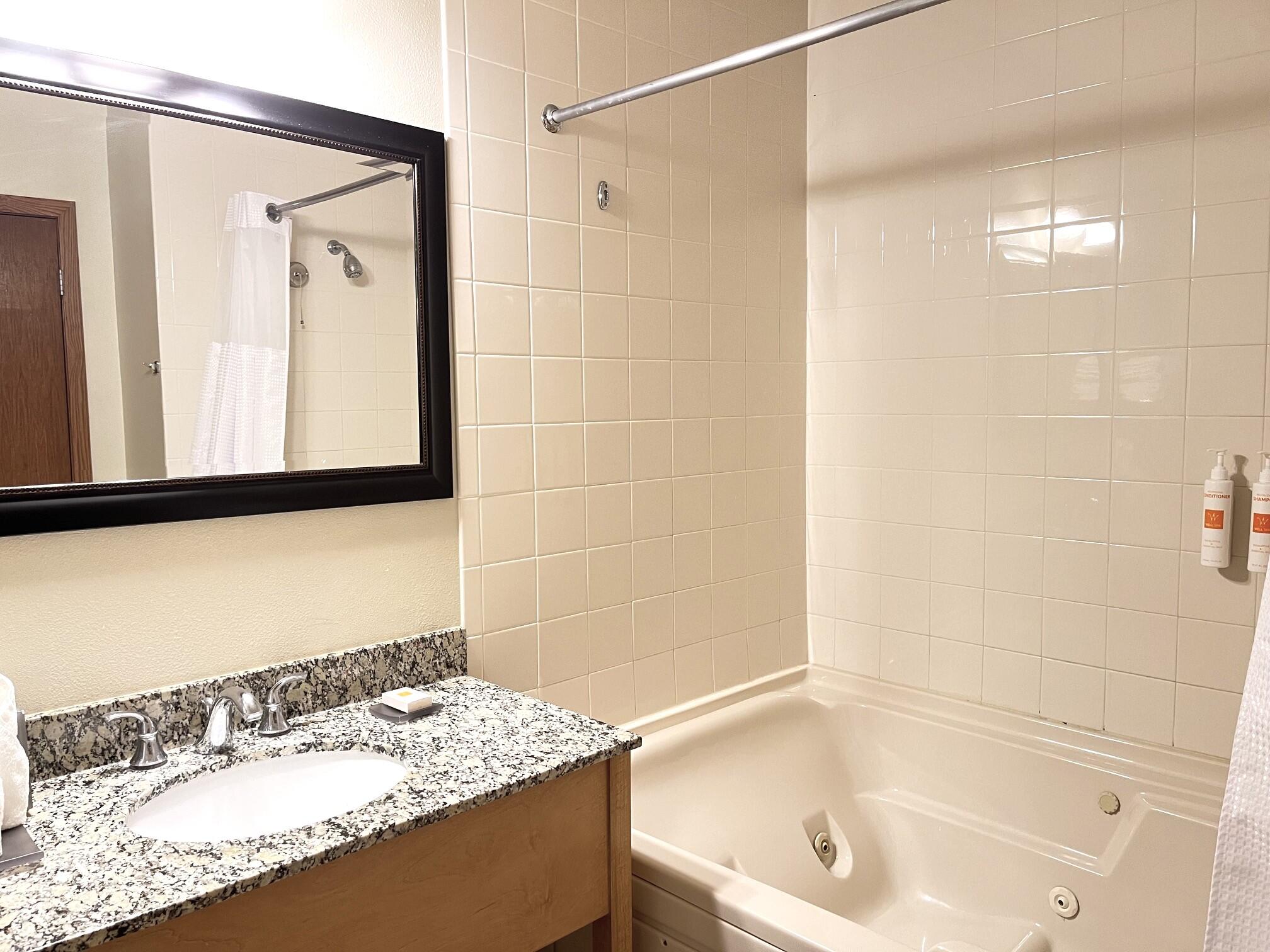 Undisclosed Address Lyons, WI 53147 - Photo 9 of 17 Jetted tub with shower, ceramic tile. Towels & toiletries included.