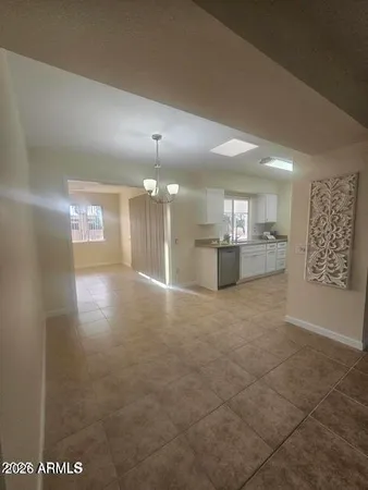 a view of a kitchen and a window