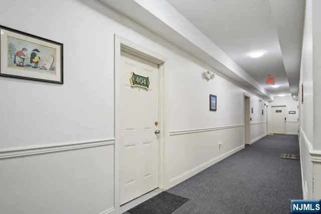 a view of a hallway with closet