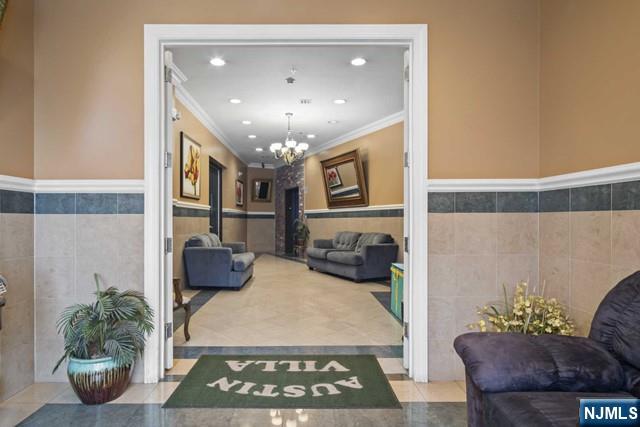 15-19 Tichenor Lane, Unit 404 Newark, NJ 07114 - Photo 19 of 22 a view of a livingroom and a dining room with furniture wooden floor and a chandelier