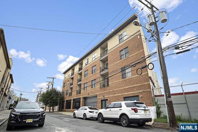 15-19 Tichenor Lane, Unit 404 Newark, NJ 07114 - Photo 20 of 22 a view of street with parked cars