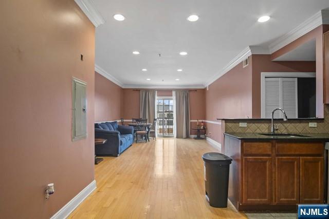 15-19 Tichenor Lane, Unit 404 Newark, NJ 07114 - Photo 2 of 22 a spacious bathroom with a granite countertop sink a mirror and a bathtub