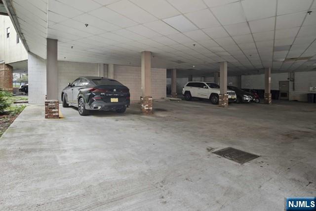 15-19 Tichenor Lane, Unit 404 Newark, NJ 07114 - Photo 21 of 22 a car parked in parking