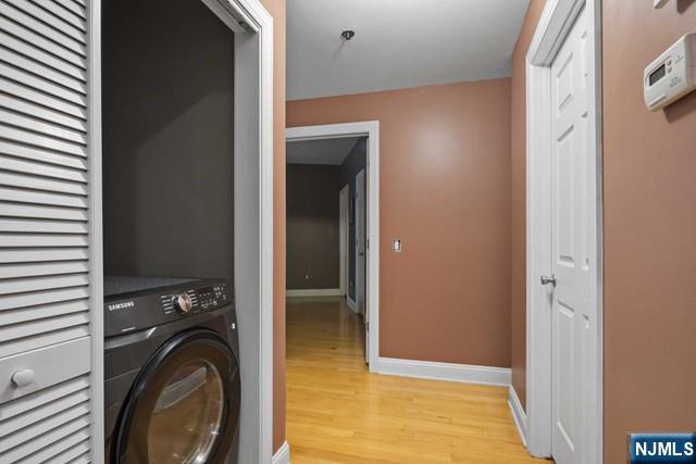 15-19 Tichenor Lane, Unit 404 Newark, NJ 07114 - Photo 10 of 22 a view of a hallway with washer and dryer