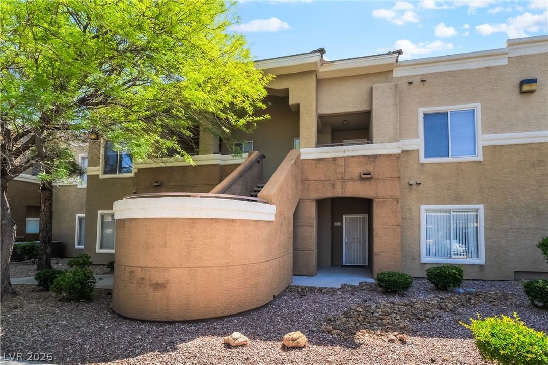 8070 West Russell Road, Unit 2024 Las Vegas, NV 89113 - Photo 1 of 19 A welcoming entryway with exterior stairs leads to this multi-level dwelling.