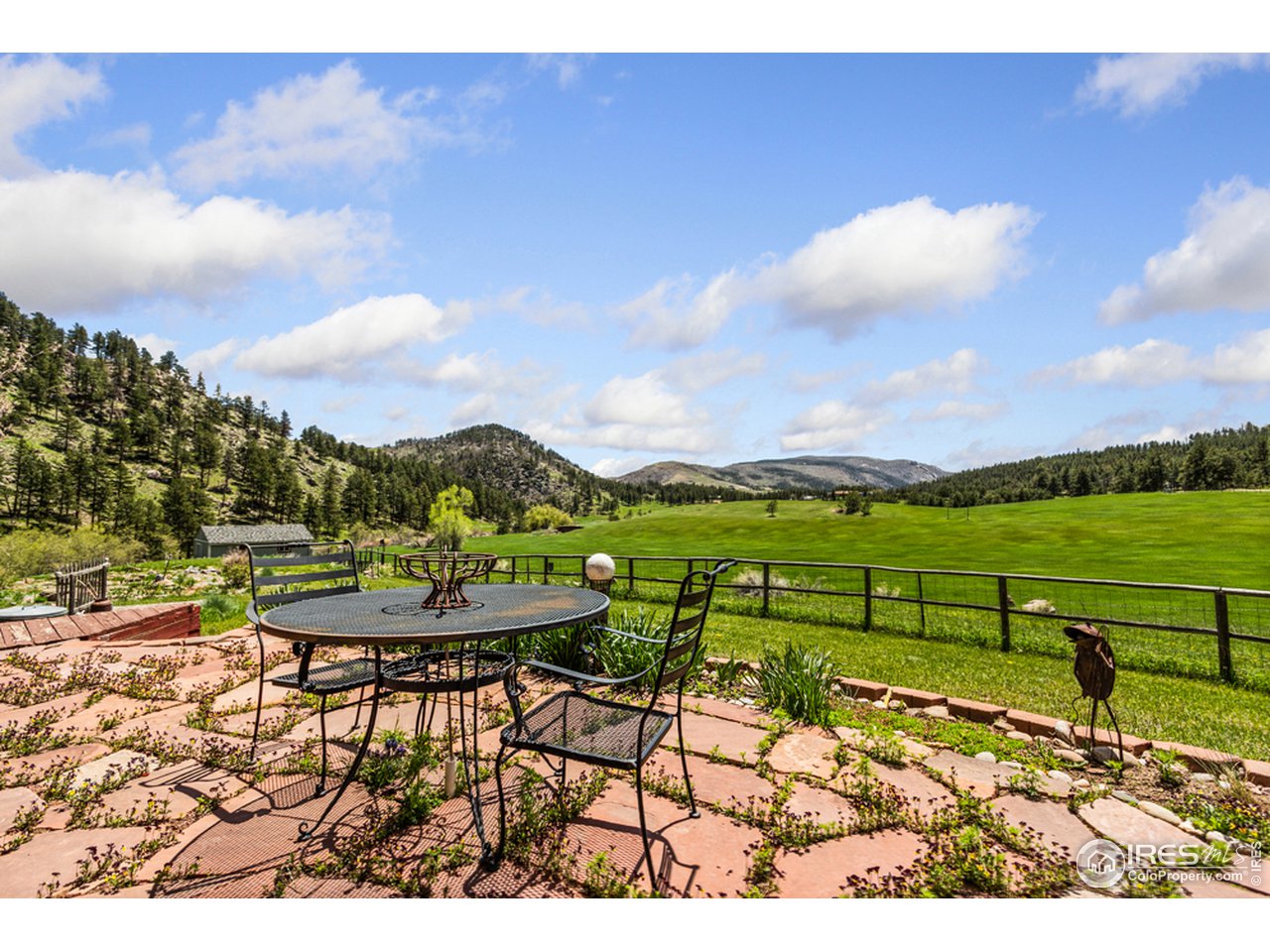 11900 Rist Canyon Road Bellvue, CO 80512 - Photo 12 of 34 a view of a lake with a yard