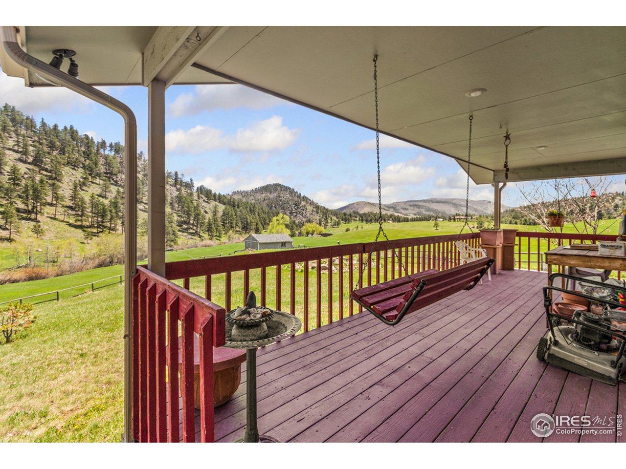 11900 Rist Canyon Road Bellvue, CO 80512 - Photo 13 of 34 a view of a balcony with wooden floor