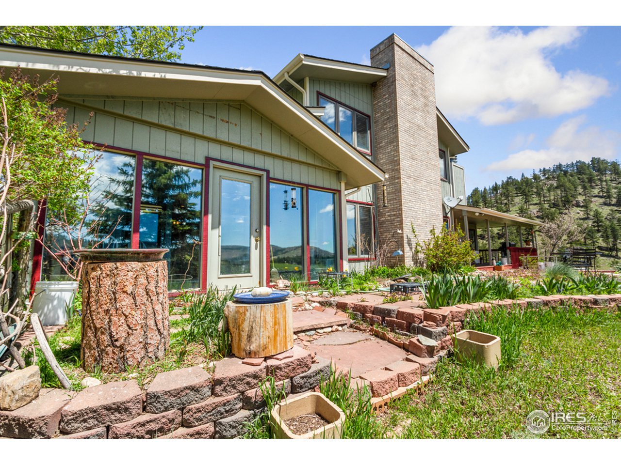 11900 Rist Canyon Road Bellvue, CO 80512 - Photo 25 of 34 a front view of a house with garden