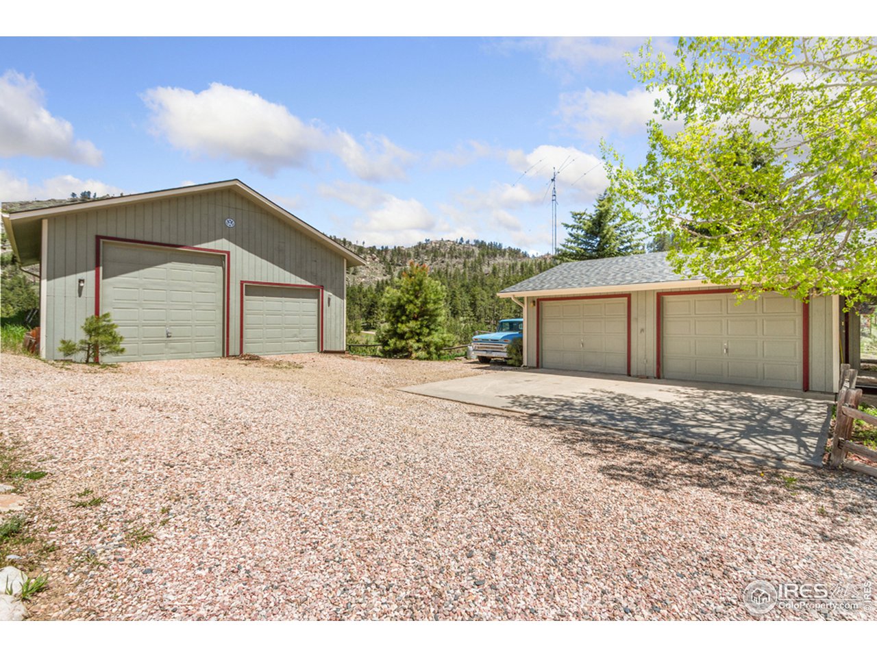 11900 Rist Canyon Road Bellvue, CO 80512 - Photo 27 of 34 a view of a house with a yard and garage