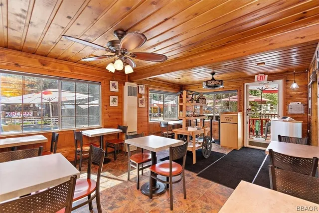 a outdoor dining space with furniture and outdoor view