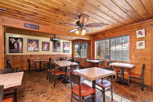 a view of a big room with furniture window and wooden floor