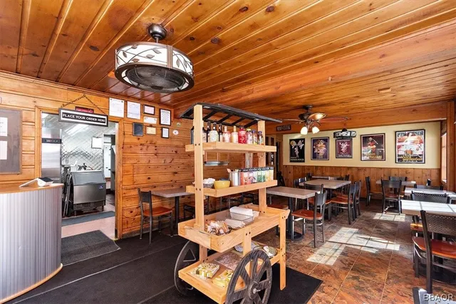 a kitchen with refrigerator and cabinets