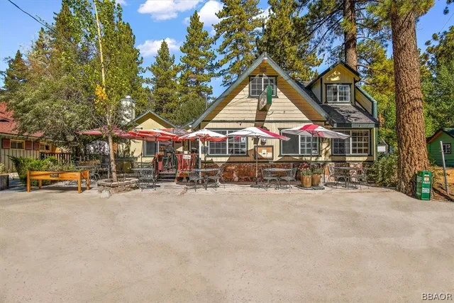 an outdoor space with furniture and in a garden