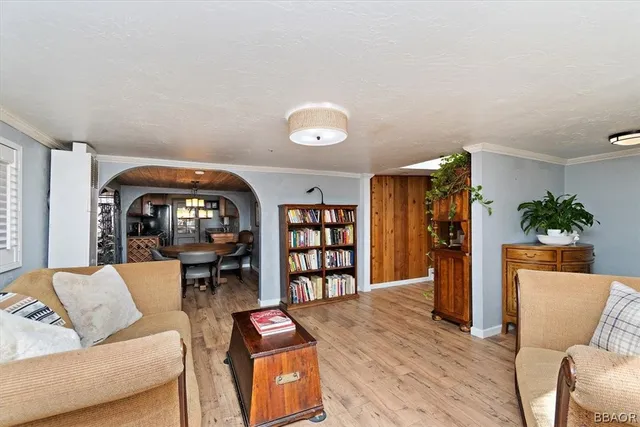 a living room with furniture and a book shelf