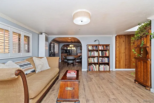 a kitchen with stainless steel appliances granite countertop a sink a stove and a wooden cabinets