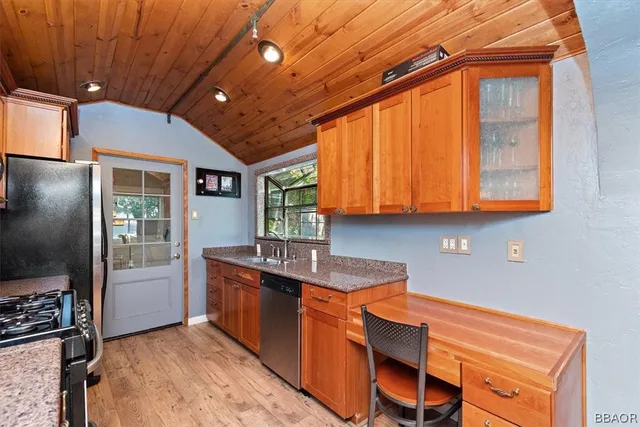 a view of washer and dryer with bathroom in the background