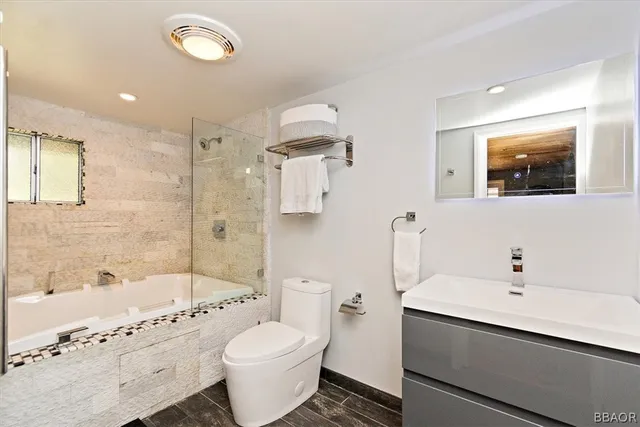 a bed room with a bed and a chandelier