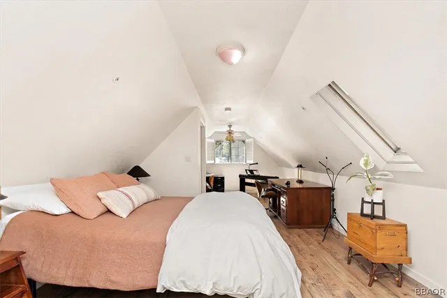 a bathroom with a granite countertop sink a toilet and a shower
