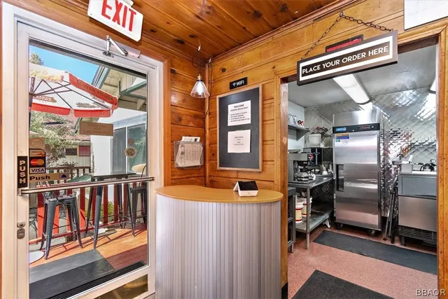 a dining room with lots of furniture and rug