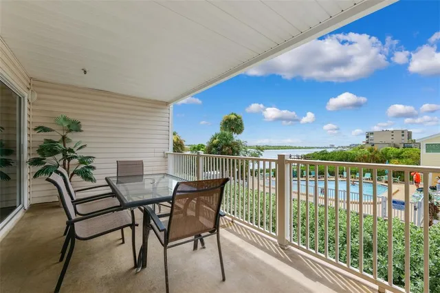 a view of a chairs and table in patio