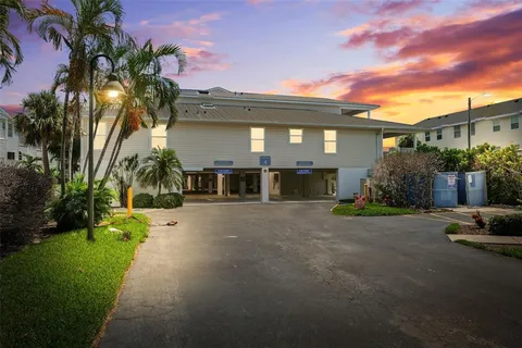 a front view of a house with a yard and a garage