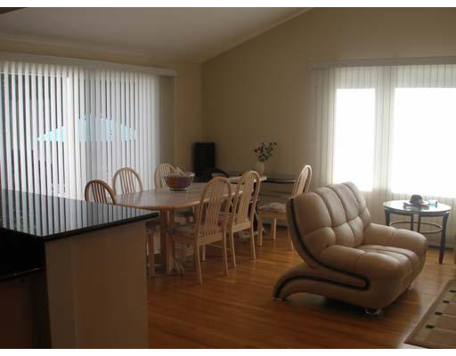 71 Cynthia Road Newton, MA 02459 - Photo 4 of 12 a living room with furniture a rug and a window