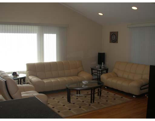 71 Cynthia Road Newton, MA 02459 - Photo 5 of 12 a living room with furniture and a large window