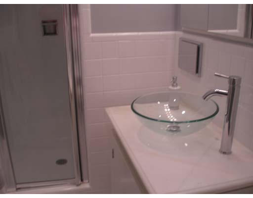 71 Cynthia Road Newton, MA 02459 - Photo 8 of 12 a bathroom with a sink and a mirror