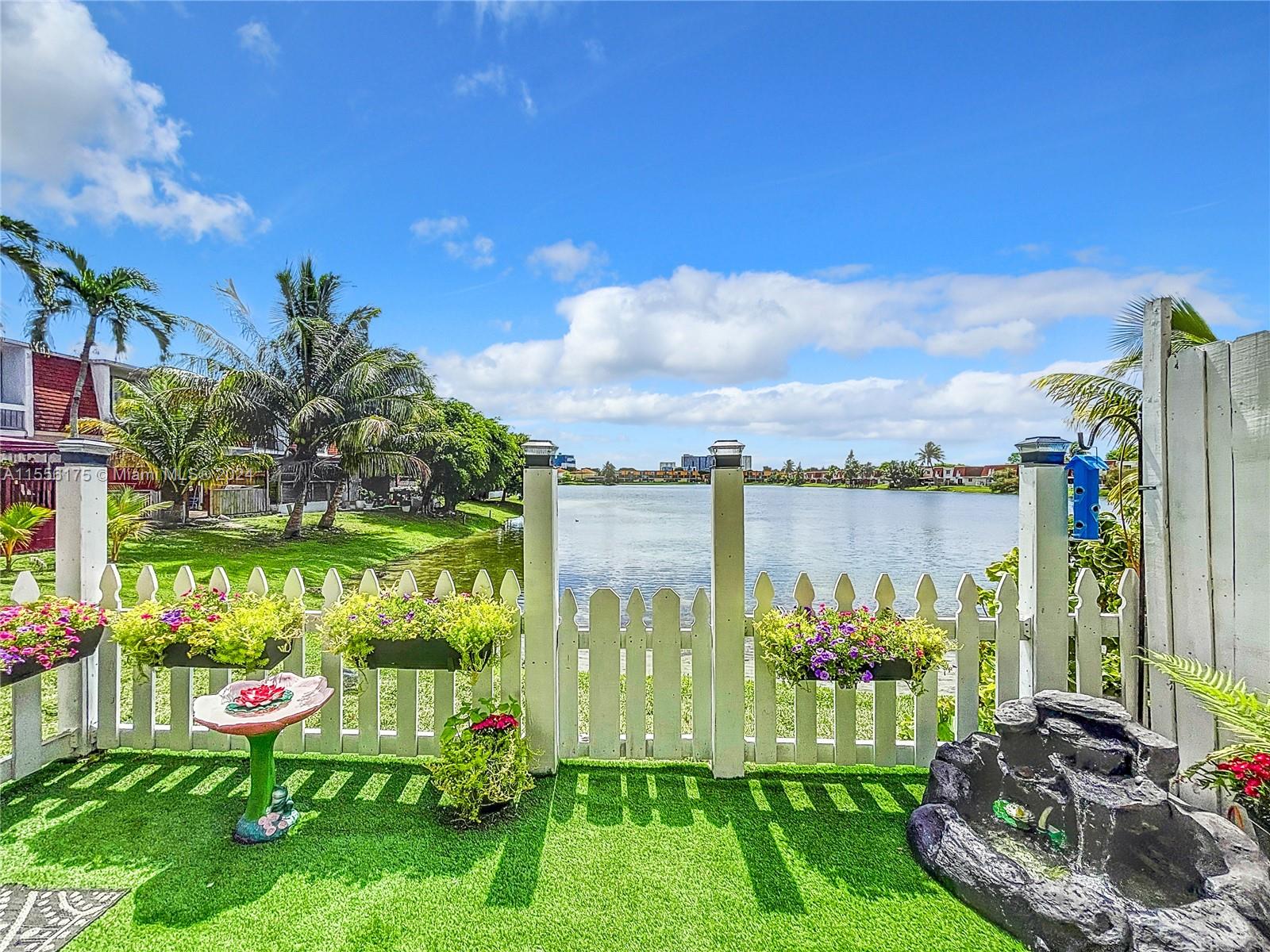 a view of swimming pool yard from a lake