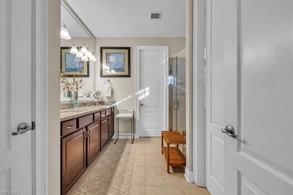 16424 Windsor Way Alva, FL 33920 - Photo 19 of 48 a bathroom with a sink and mirror