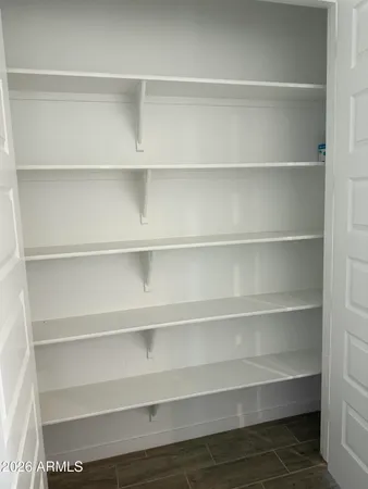 a view of a swimming pool with a table and chairs