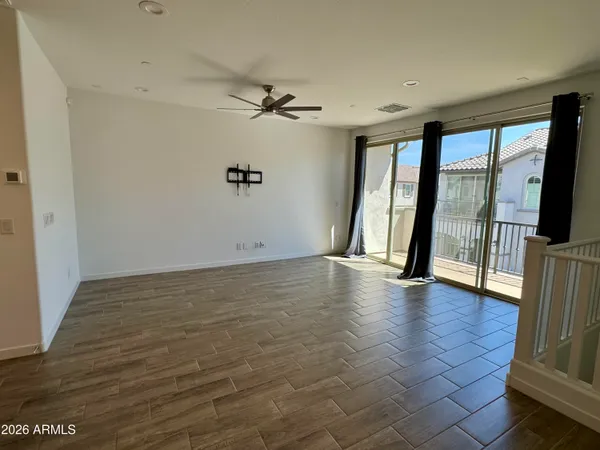 a view of a big building with a big yard and large trees