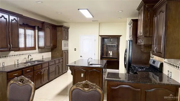 a bathroom with a sink double vanity and a mirror
