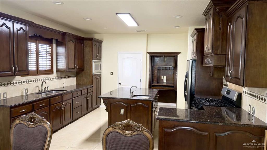 2104 Foggy Loop Laredo, TX 78045 - Photo 11 of 23 a bathroom with a sink double vanity and a mirror