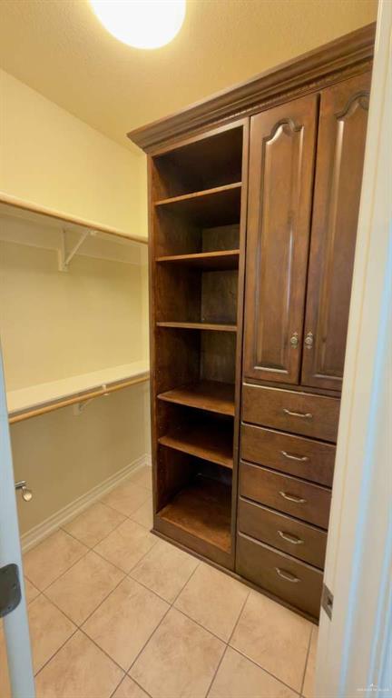 2104 Foggy Loop Laredo, TX 78045 - Photo 15 of 23 a view of walk in closet with empty racks