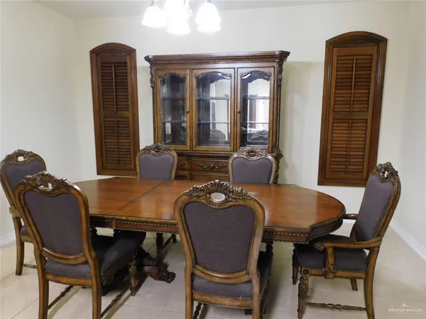 a dining room with furniture and window