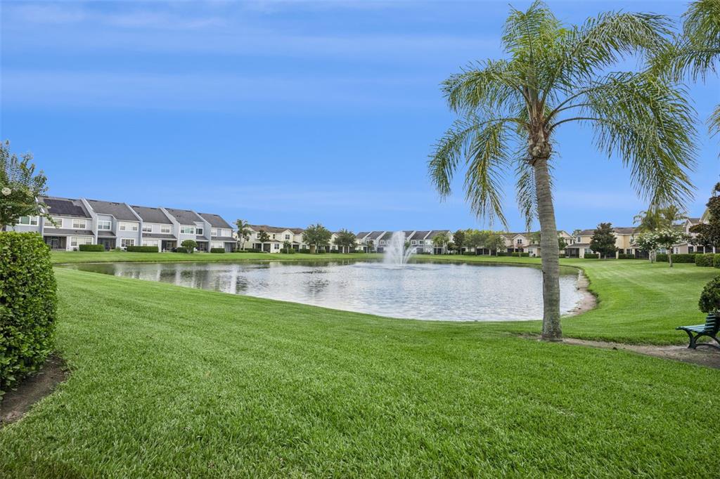 551 Terrace Spring Drive Orlando, FL 32828 - Photo 33 of 41 a view of a lake with a yard