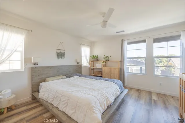 a spacious bedroom with a large bed and a window