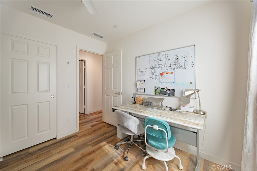 4244 Bravado Riverside, CA 92505 - Photo 17 of 25 a view of a dining room with furniture and wooden floor