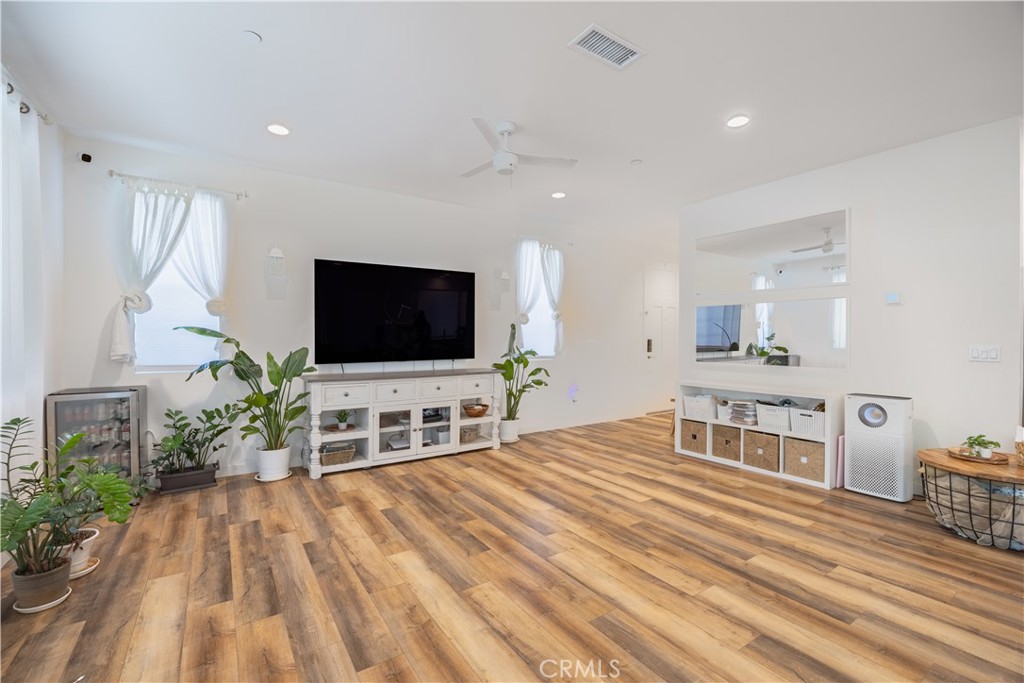 4244 Bravado Riverside, CA 92505 - Photo 7 of 25 a living room with furniture and a flat screen tv