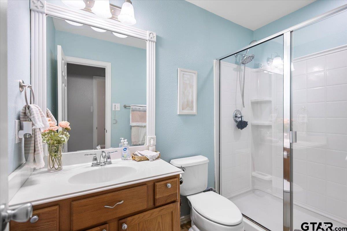 401 Boxwood Trail Forney, TX 75126 - Photo 9 of 45 a bathroom with a sink toilet mirror and shower