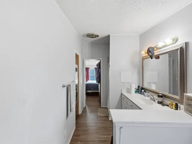 a en suite bathroom with a sink and mirror