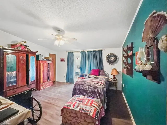 a bedroom with two beds and a chandelier