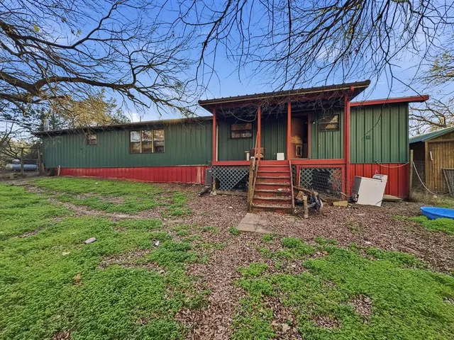 a backyard of a house with seating space