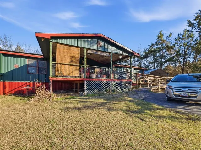 a view of swimming pool with a patio and a yard